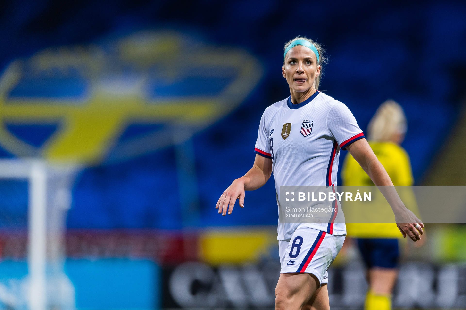 Julie Ertz of USA reacts against a call by the referee