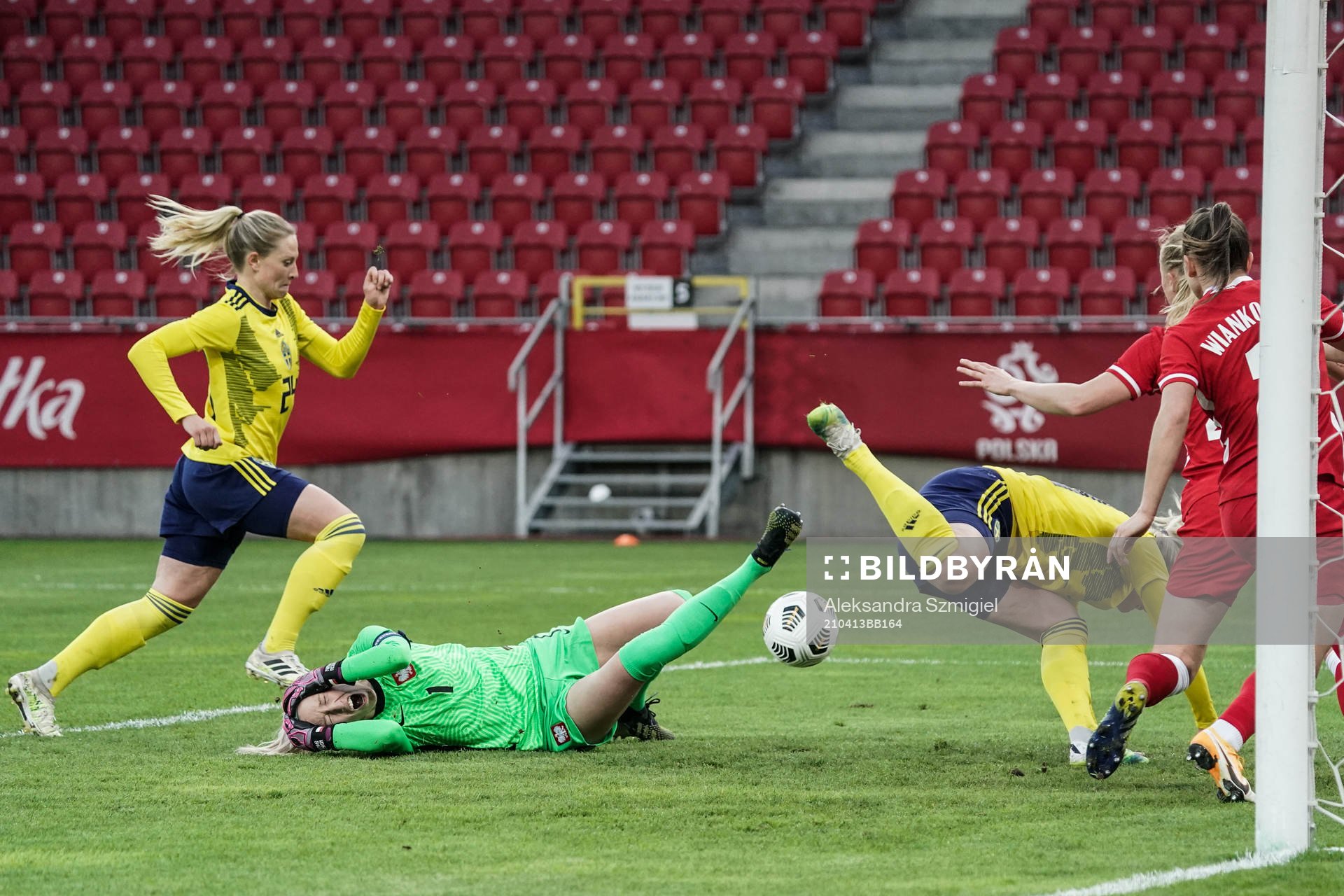 goalkeeper Katarzyna Kiedrzynek of Poland is in pain