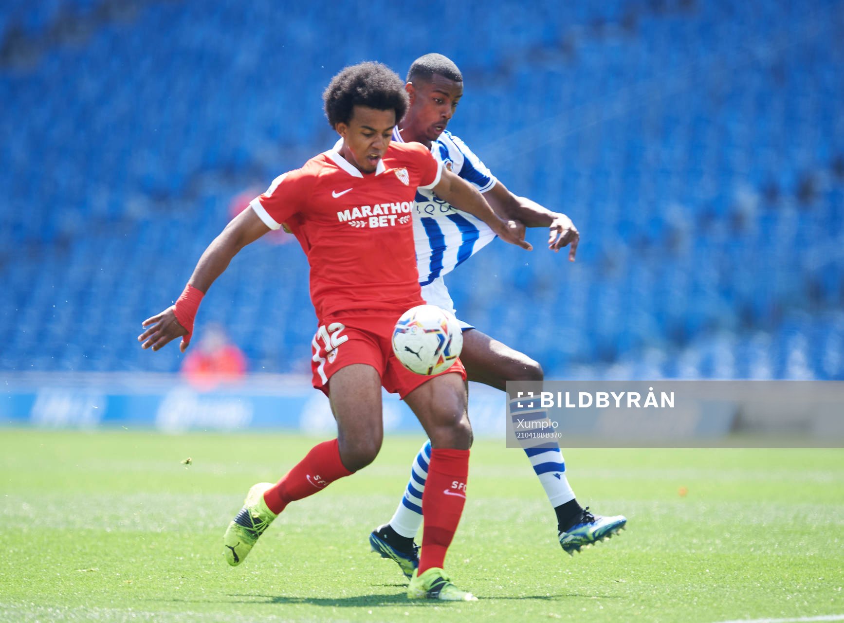 Alexander Isak of Real Sociedad duels for the ball with