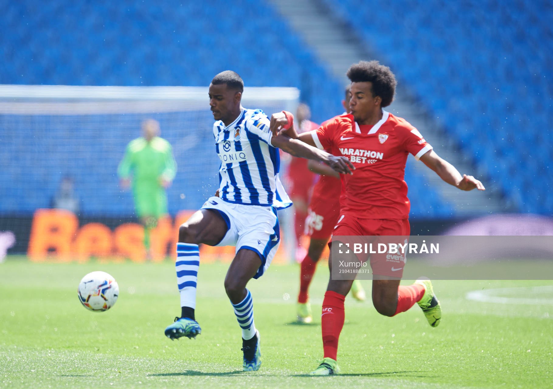 Alexander Isak of Real Sociedad duels for the ball with