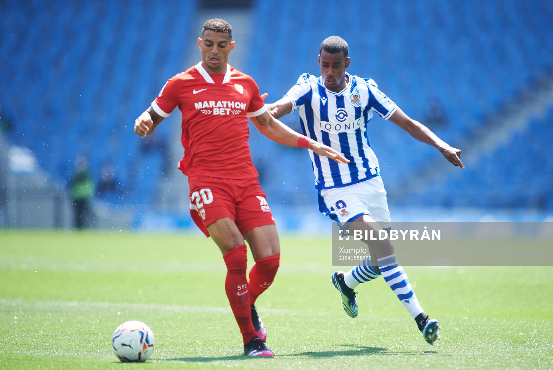 Alexander Isak of Real Sociedad duels for the ball with