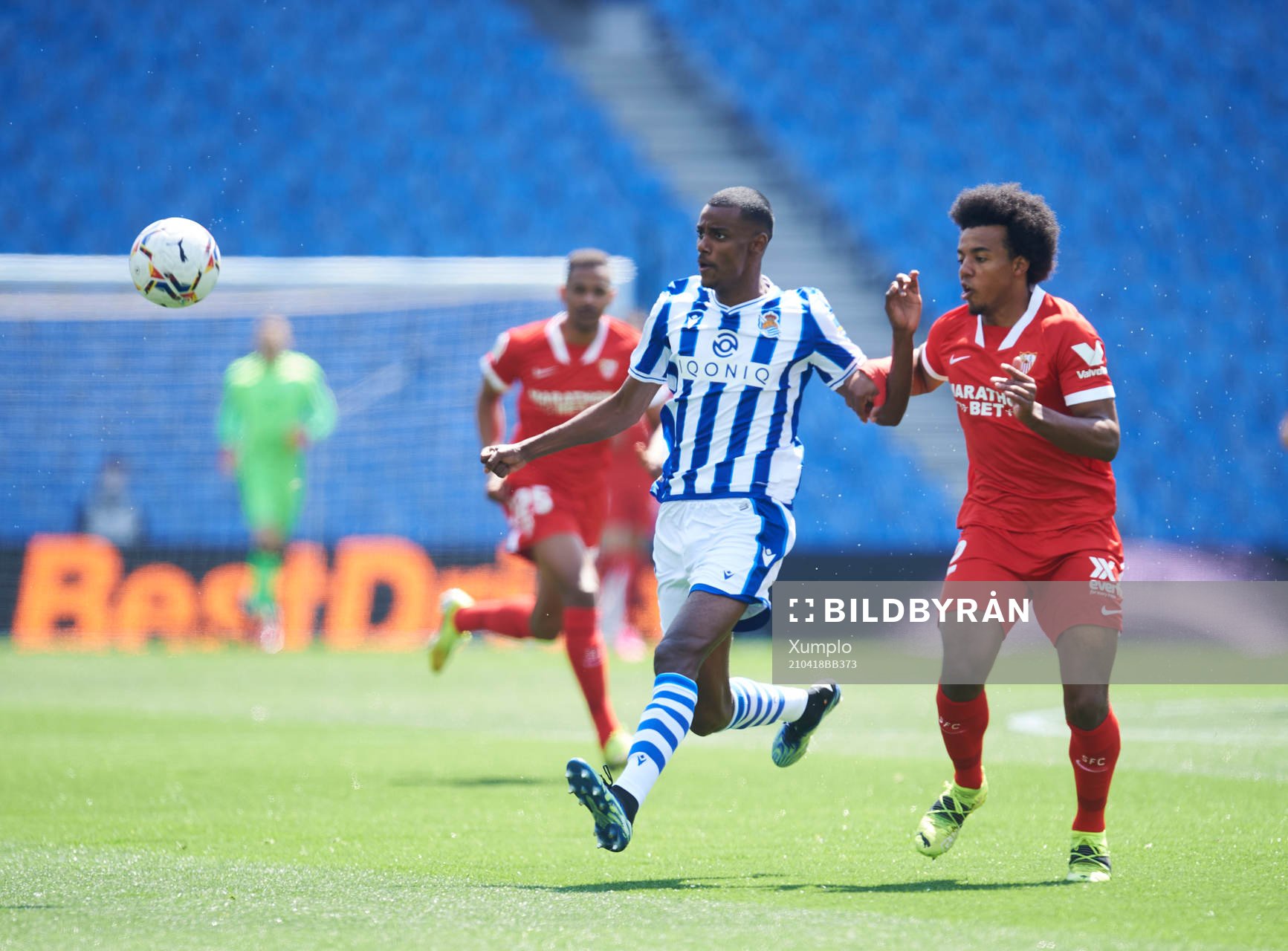 Alexander Isak of Real Sociedad duels for the ball with