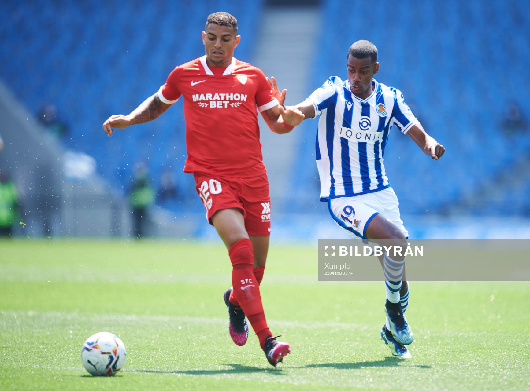 Alexander Isak of Real Sociedad duels for the ball with