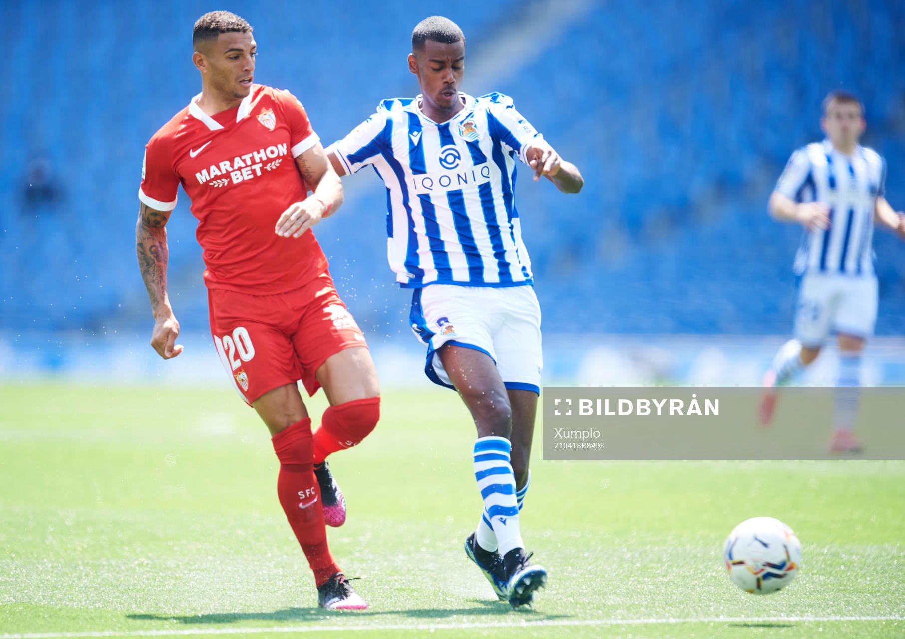 Alexander Isak of Real Sociedad duels for the ball with