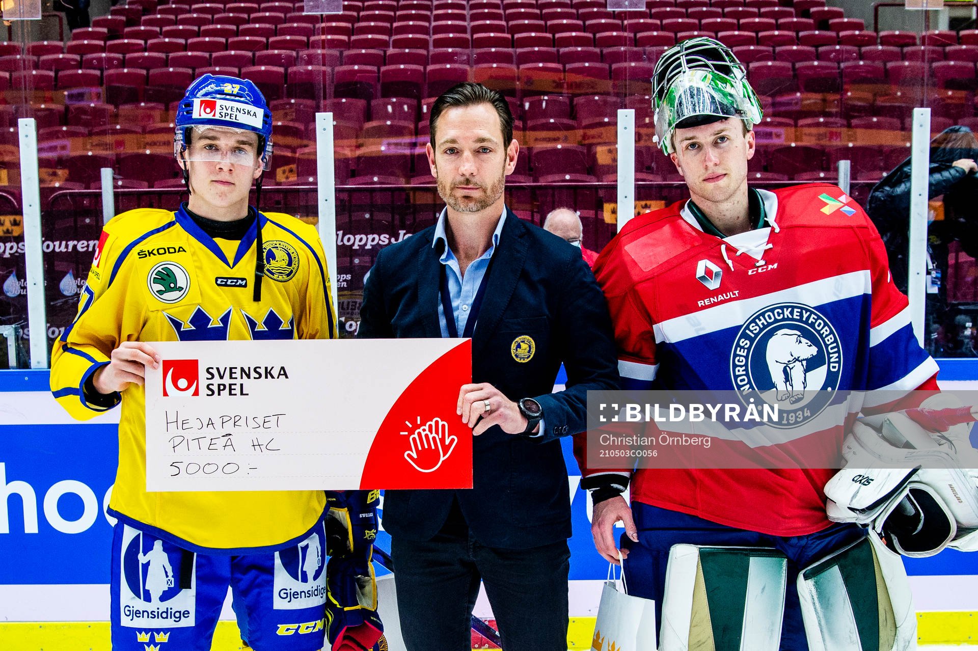 Nils Lundkvist of Sweden and goalkeeper Henrik Haukeland of
