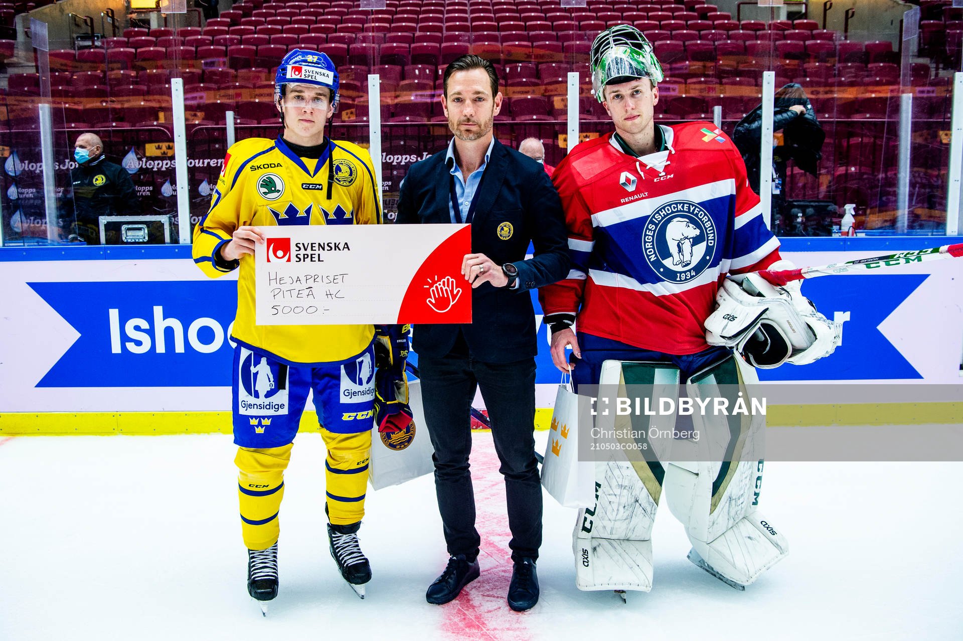 Nils Lundkvist of Sweden and goalkeeper Henrik Haukeland of