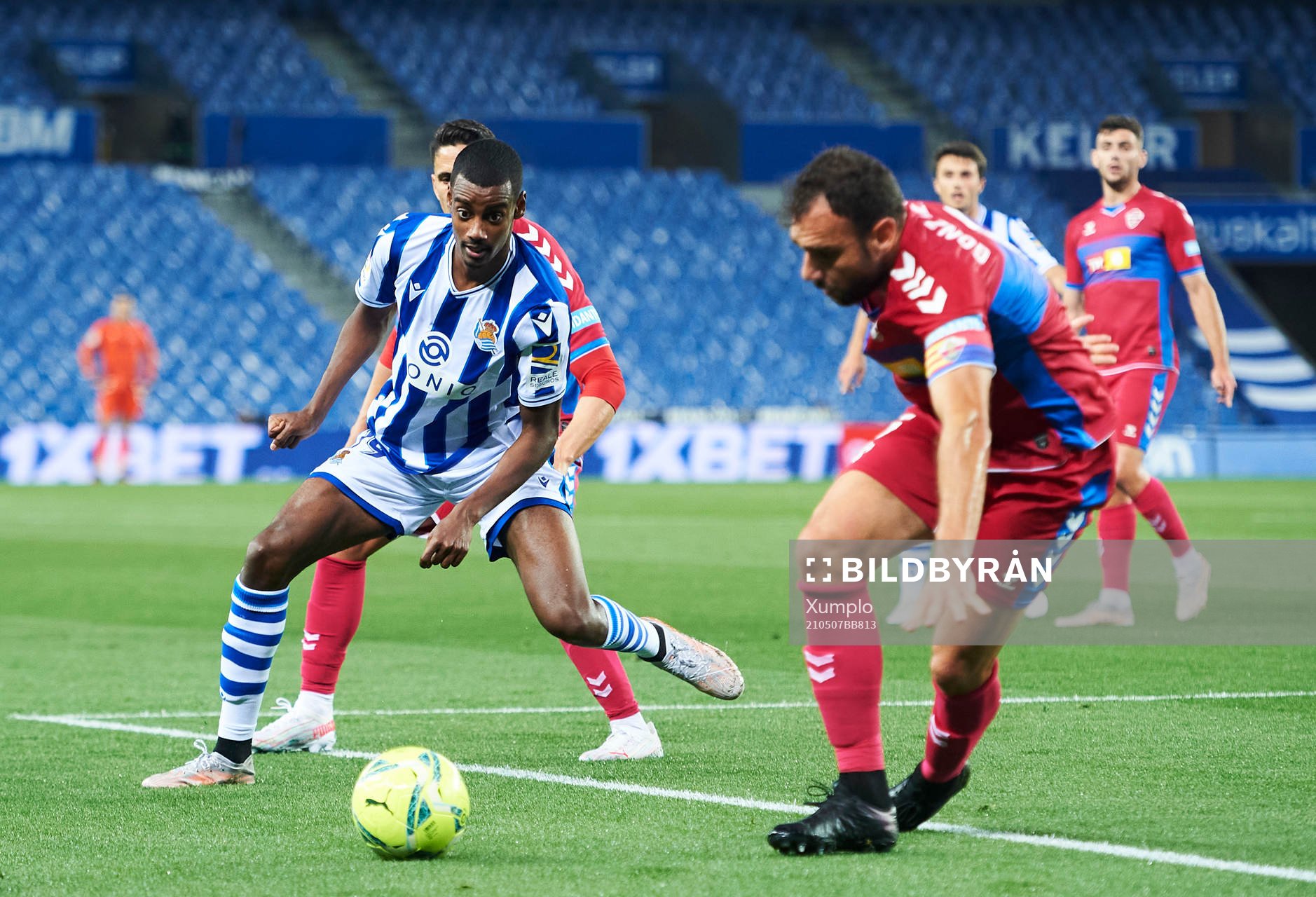 Alexander Isak of Real Sociedad duels for the ball with