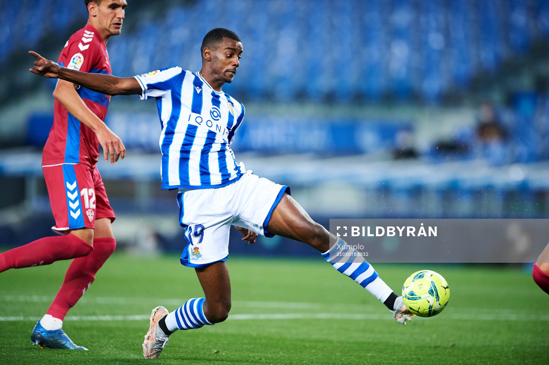 Alexander Isak of Real Sociedad duels for the ball with
