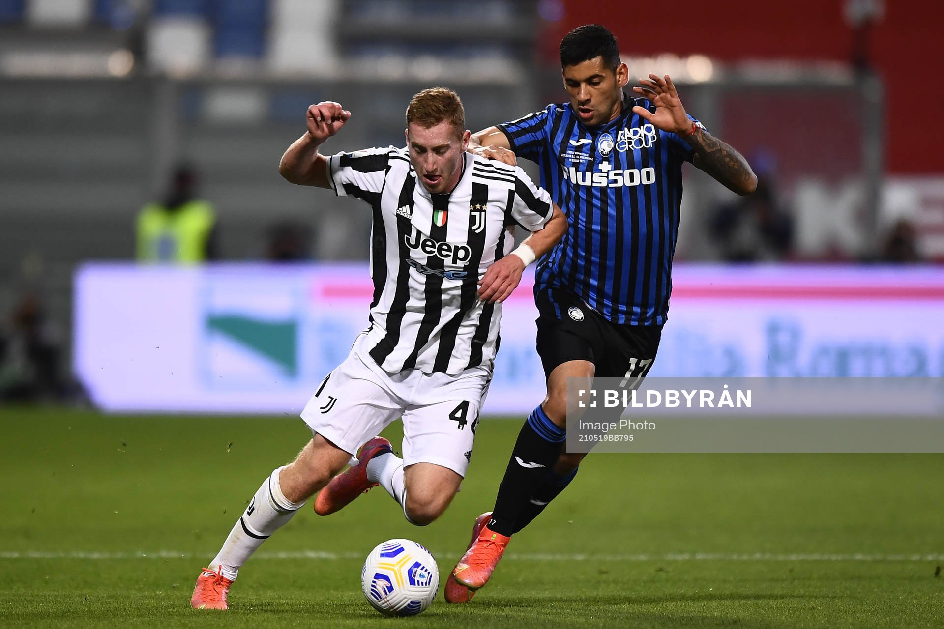 Dejan Kulusevski of Juventus and Cristian Romero of Atalanta