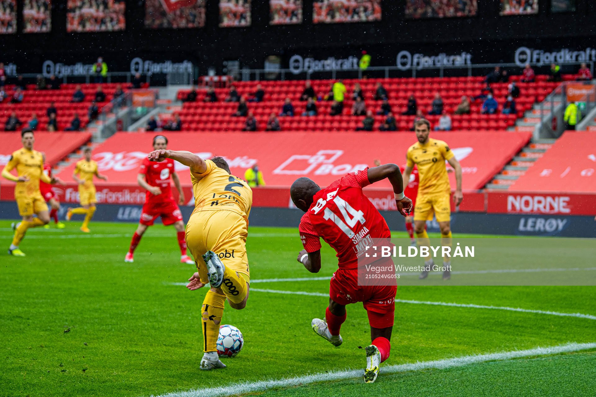 Marius Lode of Bodø/Glimt and Moonga Aluta Simba of Brann