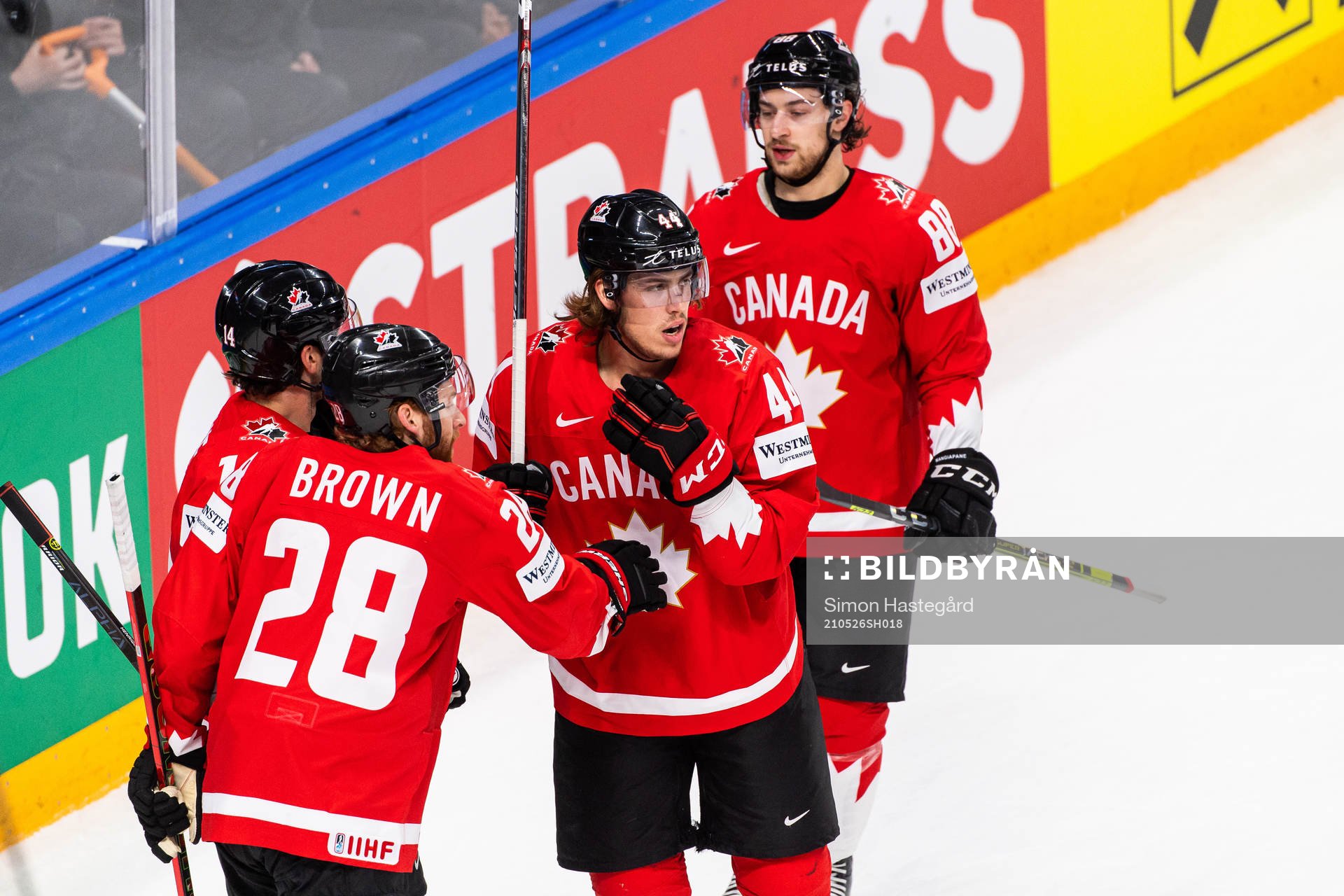 Connor Brown and Andrew Mangipane celebrate with Adam