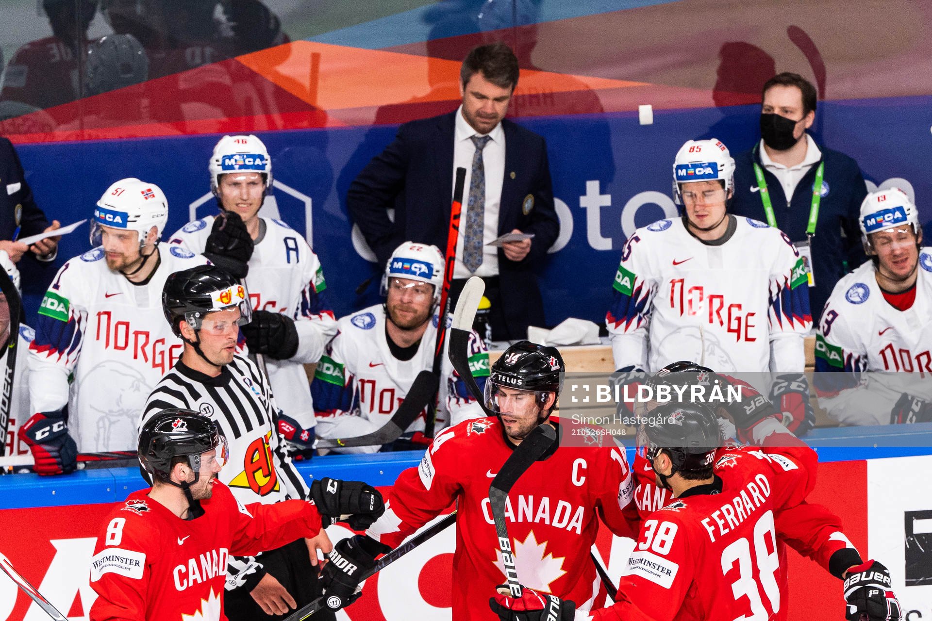 Adam Henrique of Canada celebrates with team mates
