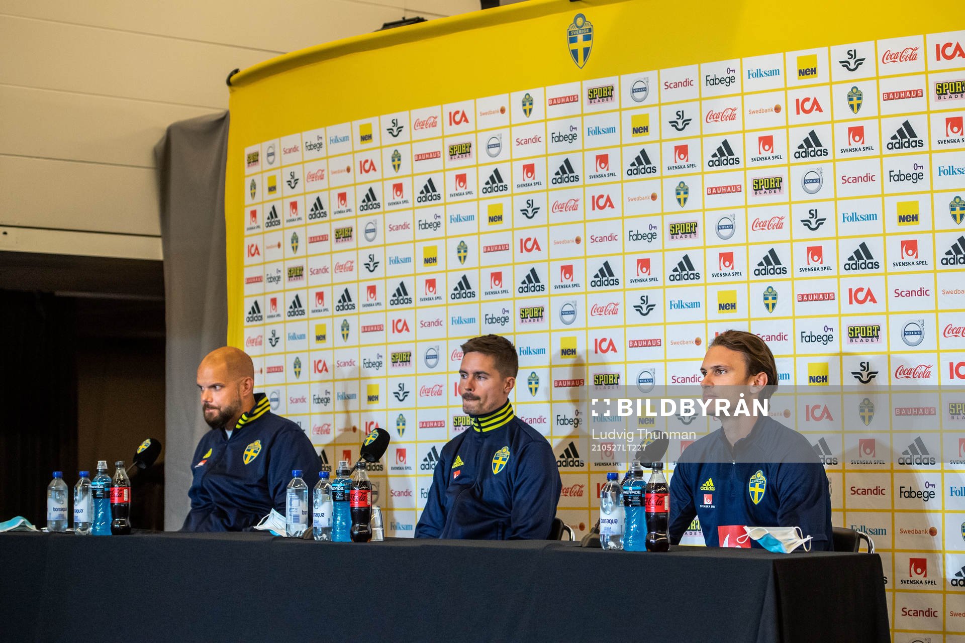 Press officer Jakob Kakembo Andersson, Mikael Lustig and