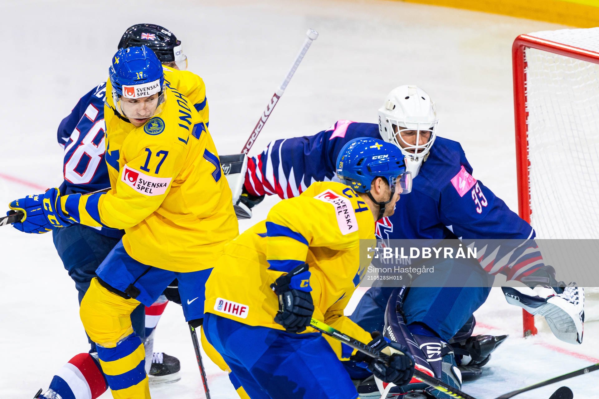 Pär Lindholm of Sweden and goalkeeper Ben Bowns of Great