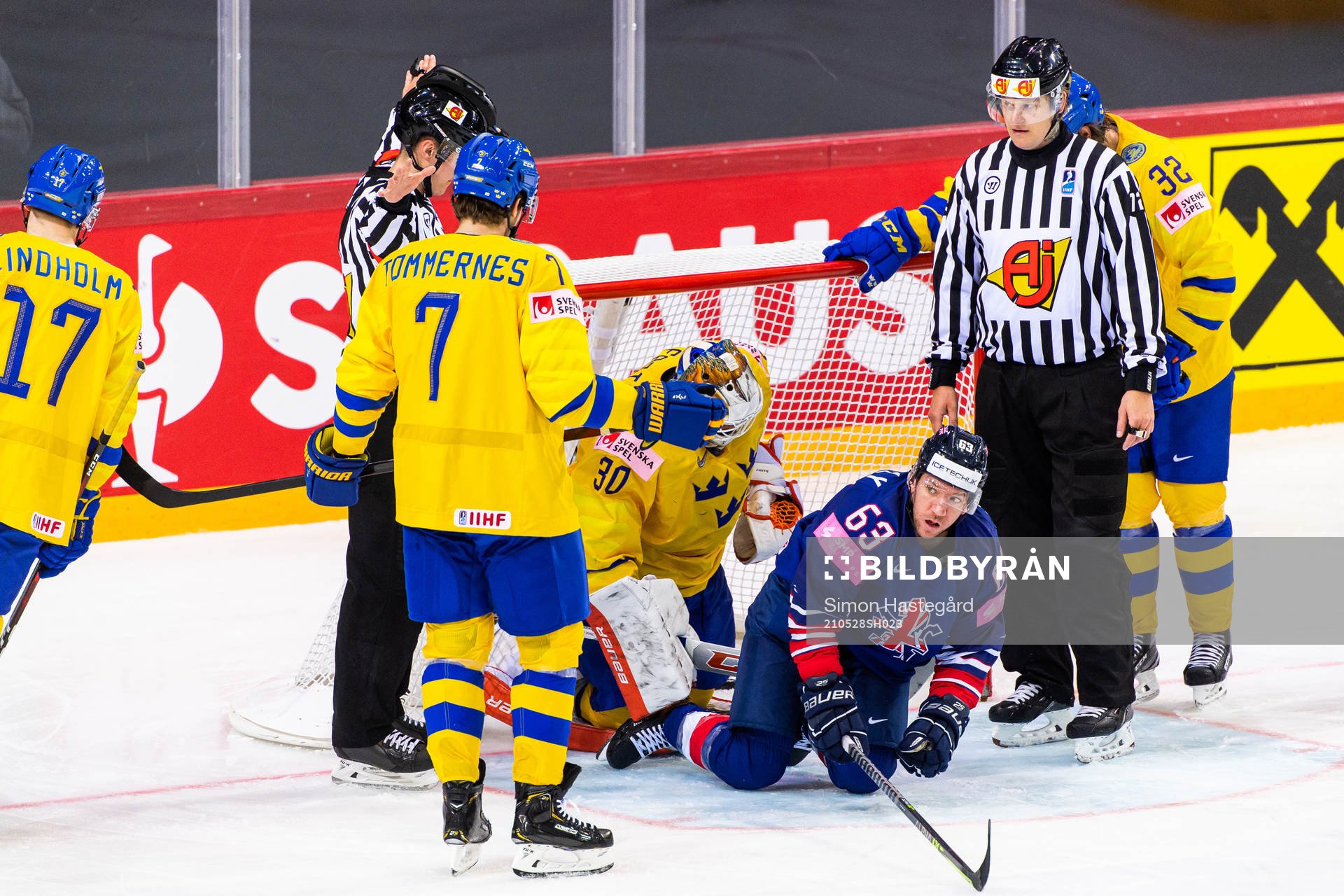 Henrik Tömmernes and goalkeeper Viktor Fasth of Sweden