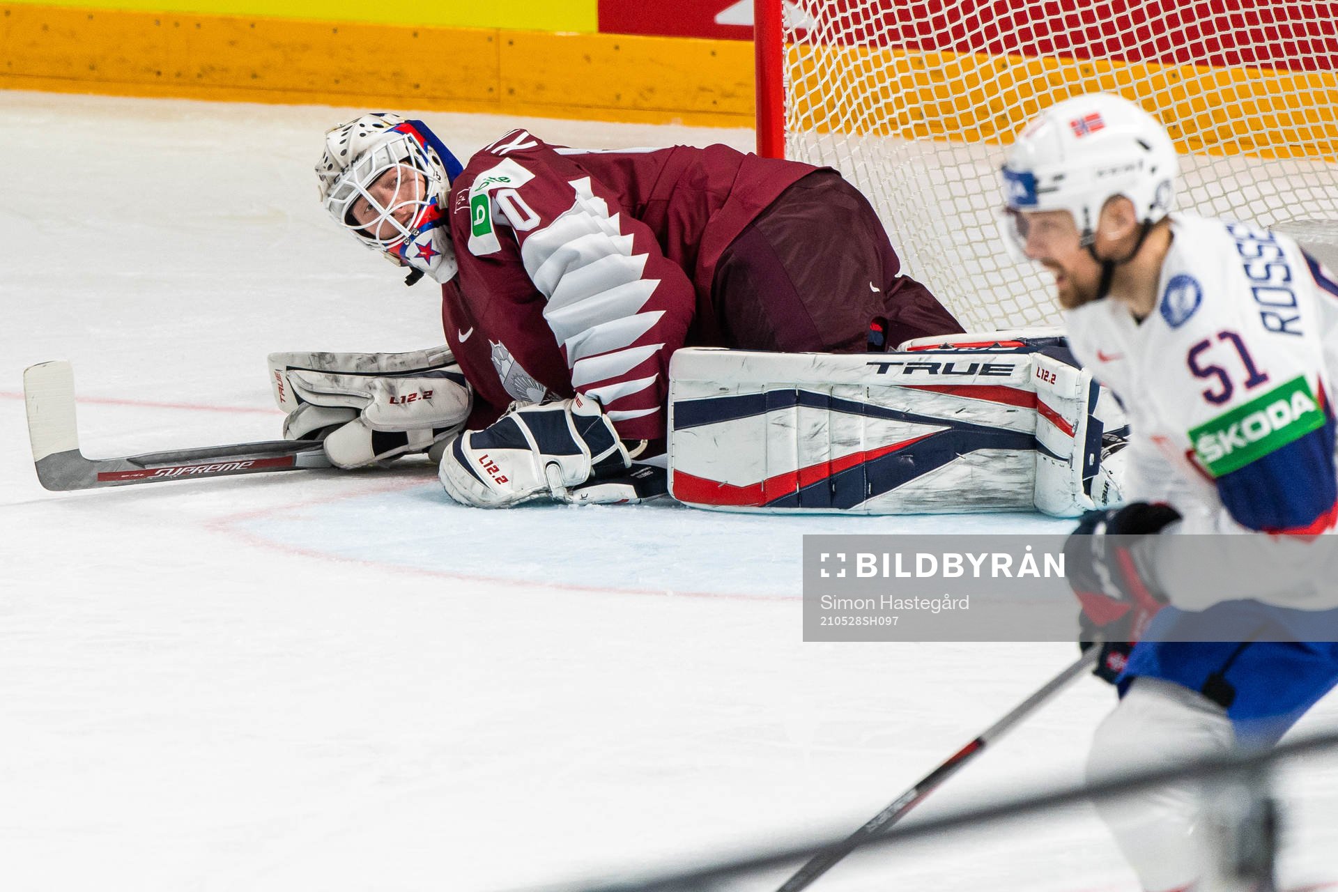 Goalkeeper Matiss Kivlenieks of Latvia and Mats Rosseli
