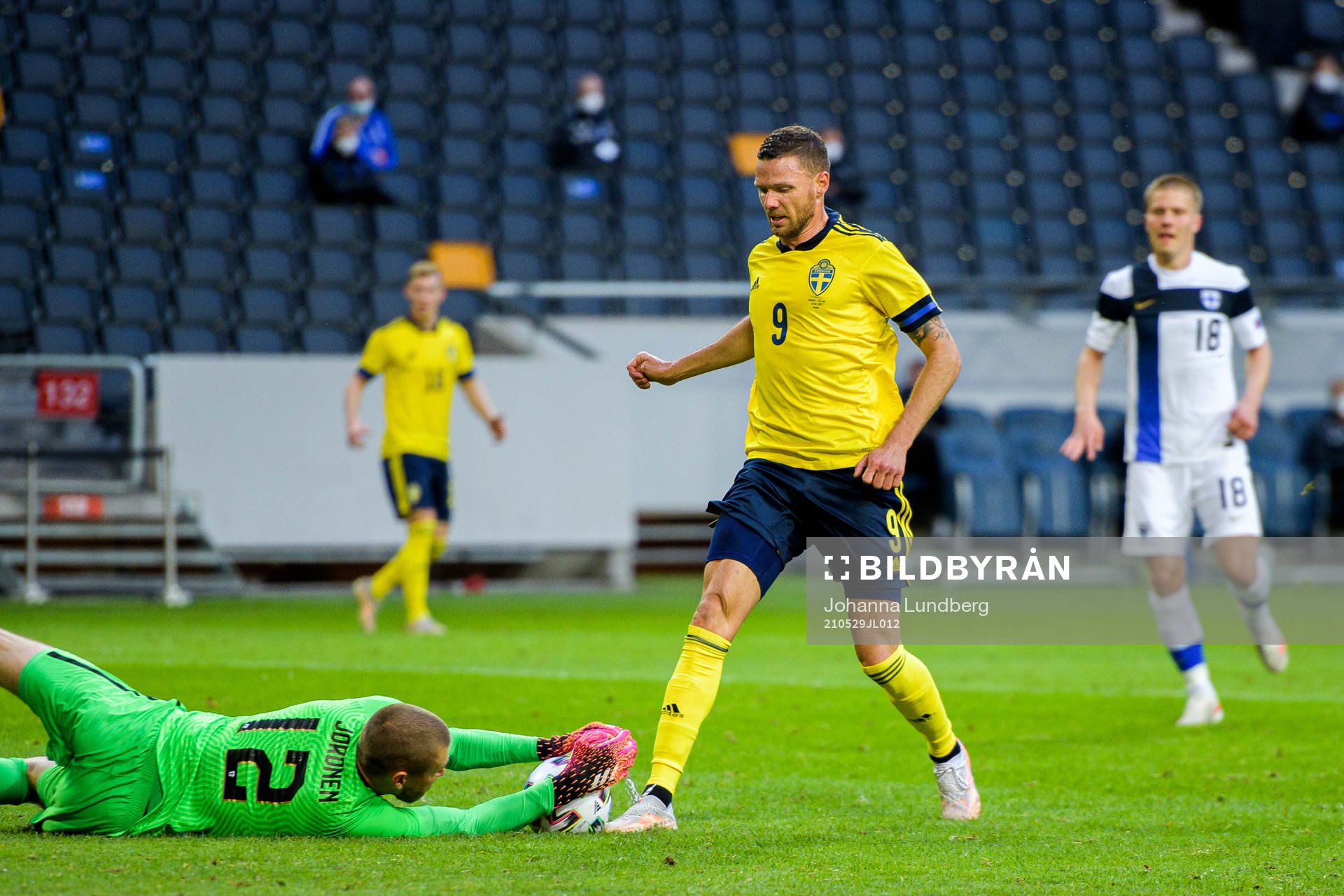 Marcus Berg of Sweden against goalkeeper Jesse Joronen of