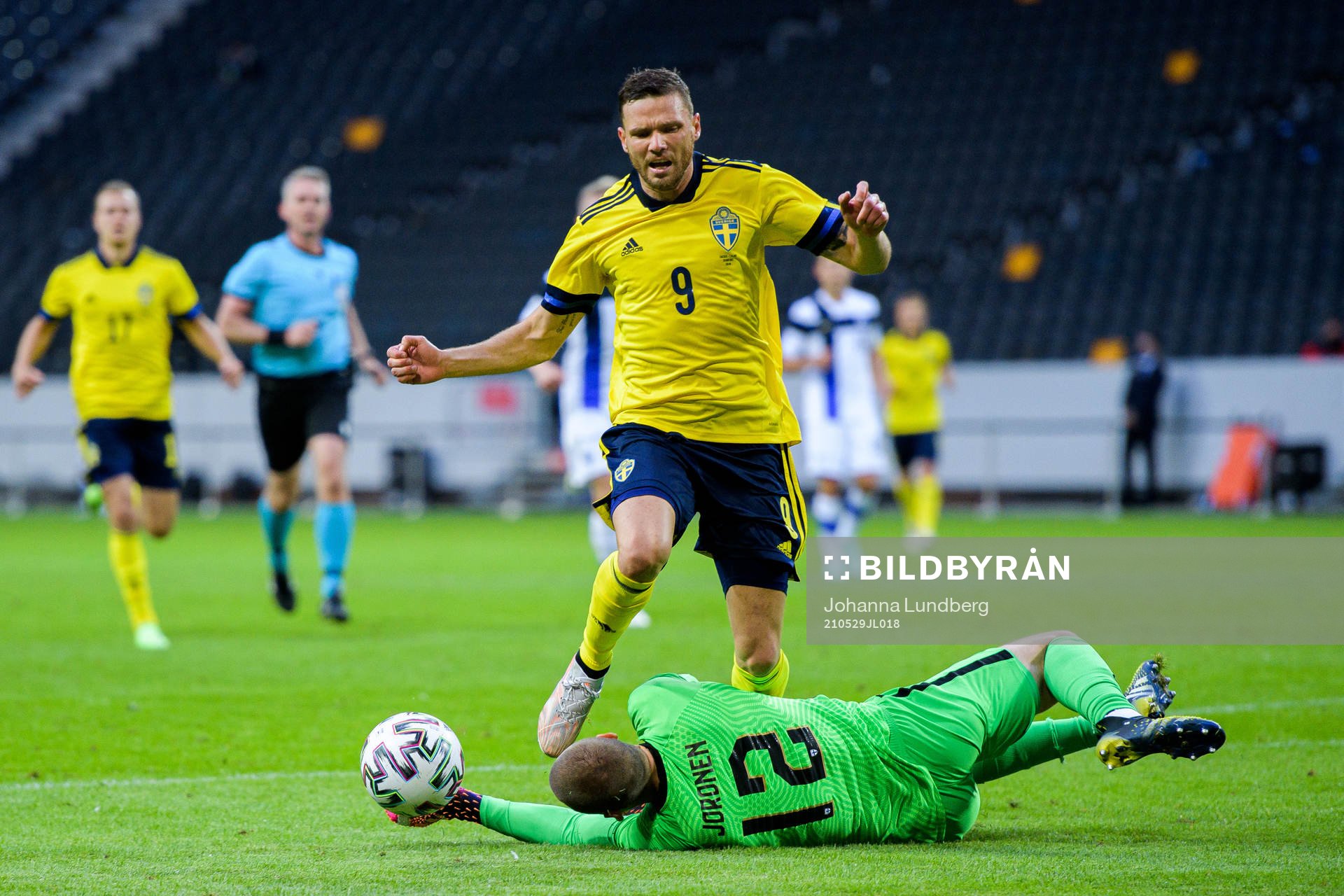 Marcus Berg of Sweden and goalkeeper Jesse Joronen of