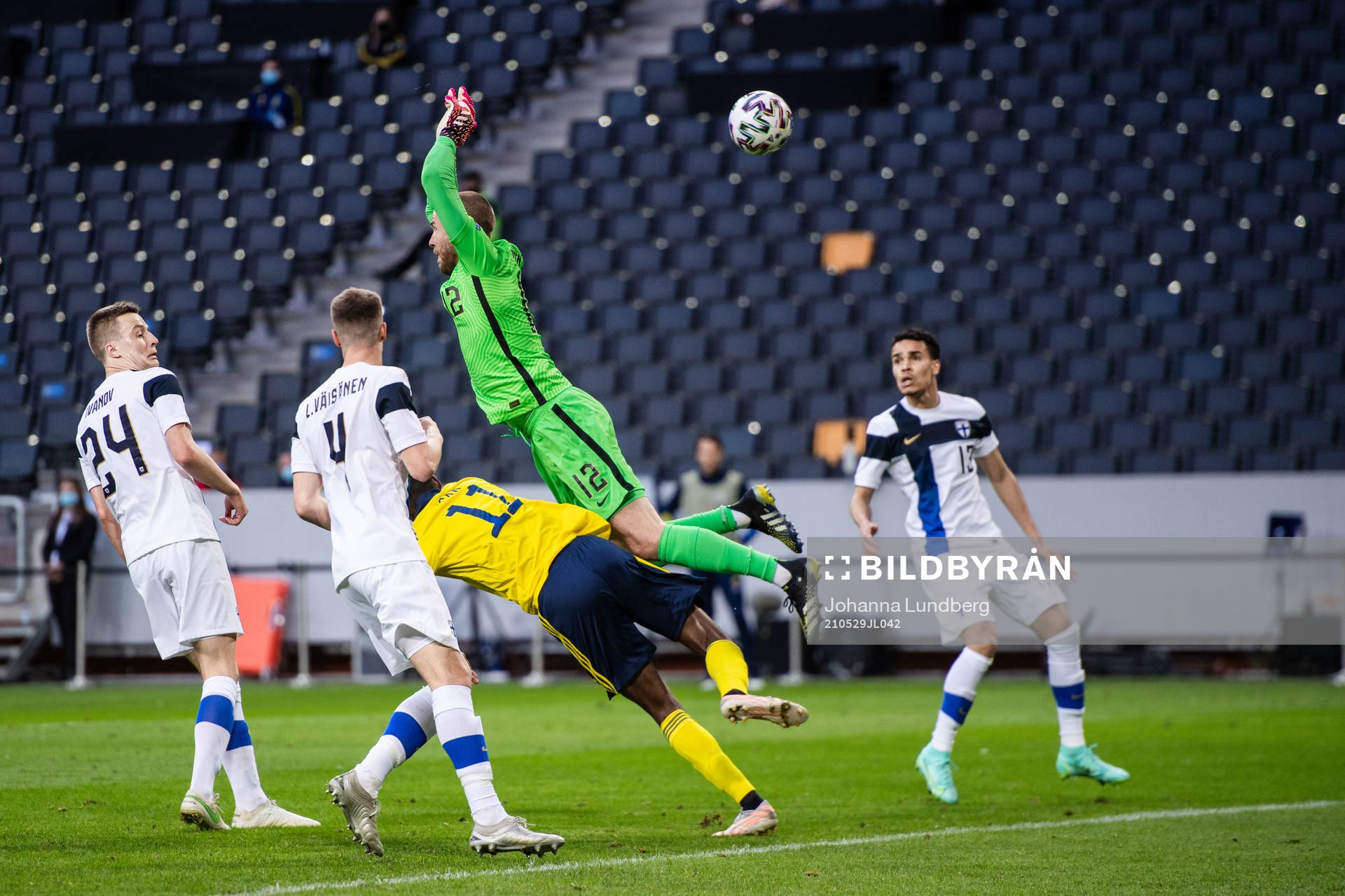Alexander Isak of Sweden and goalkeeper Jesse Joronen of
