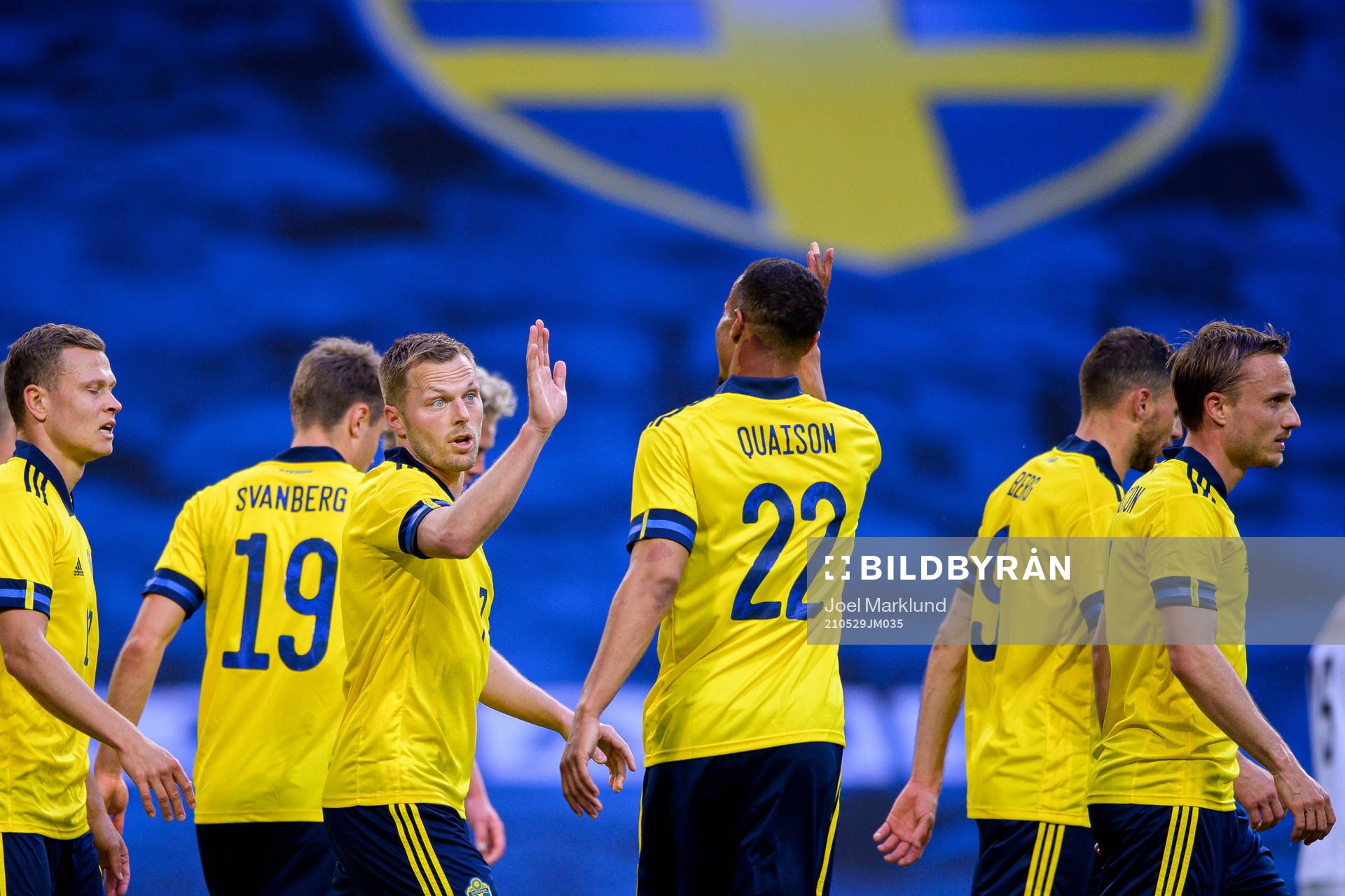 Sebastian Larsson and Robin Quaison of Sweden celebrate the