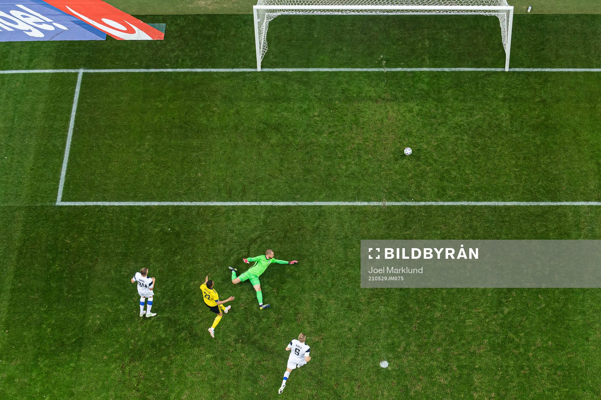 Robin Quaison of Sweden scores 1-0 behind goalkeeper Jesse