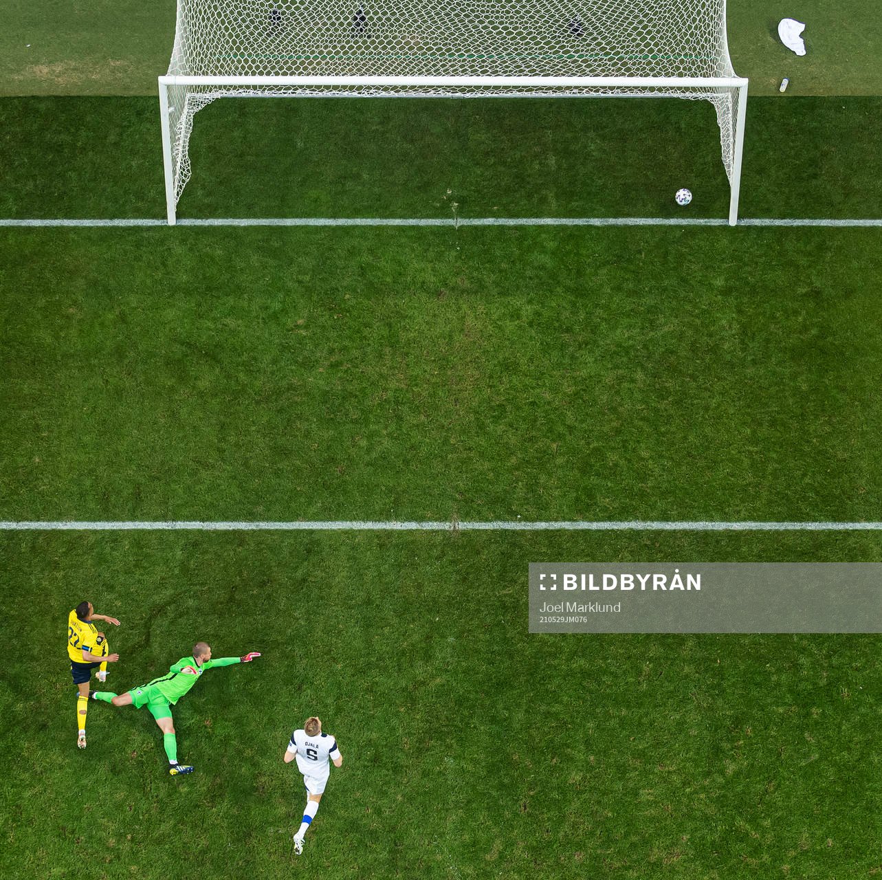 Robin Quaison of Sweden scores 1-0 behind goalkeeper Jesse