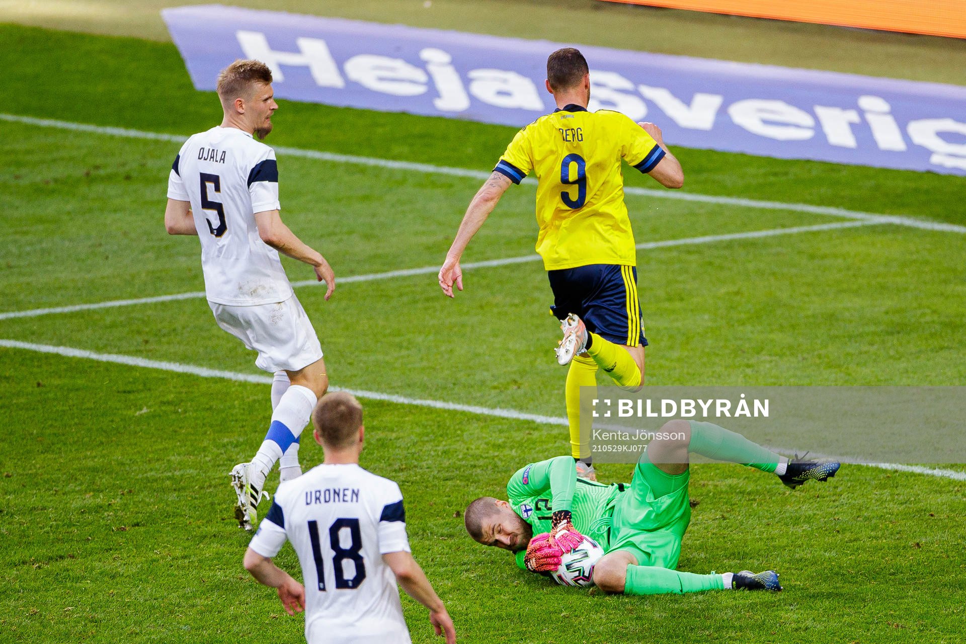 Marcus Berg of Sweden and goalkeeper Jesse Joronen of
