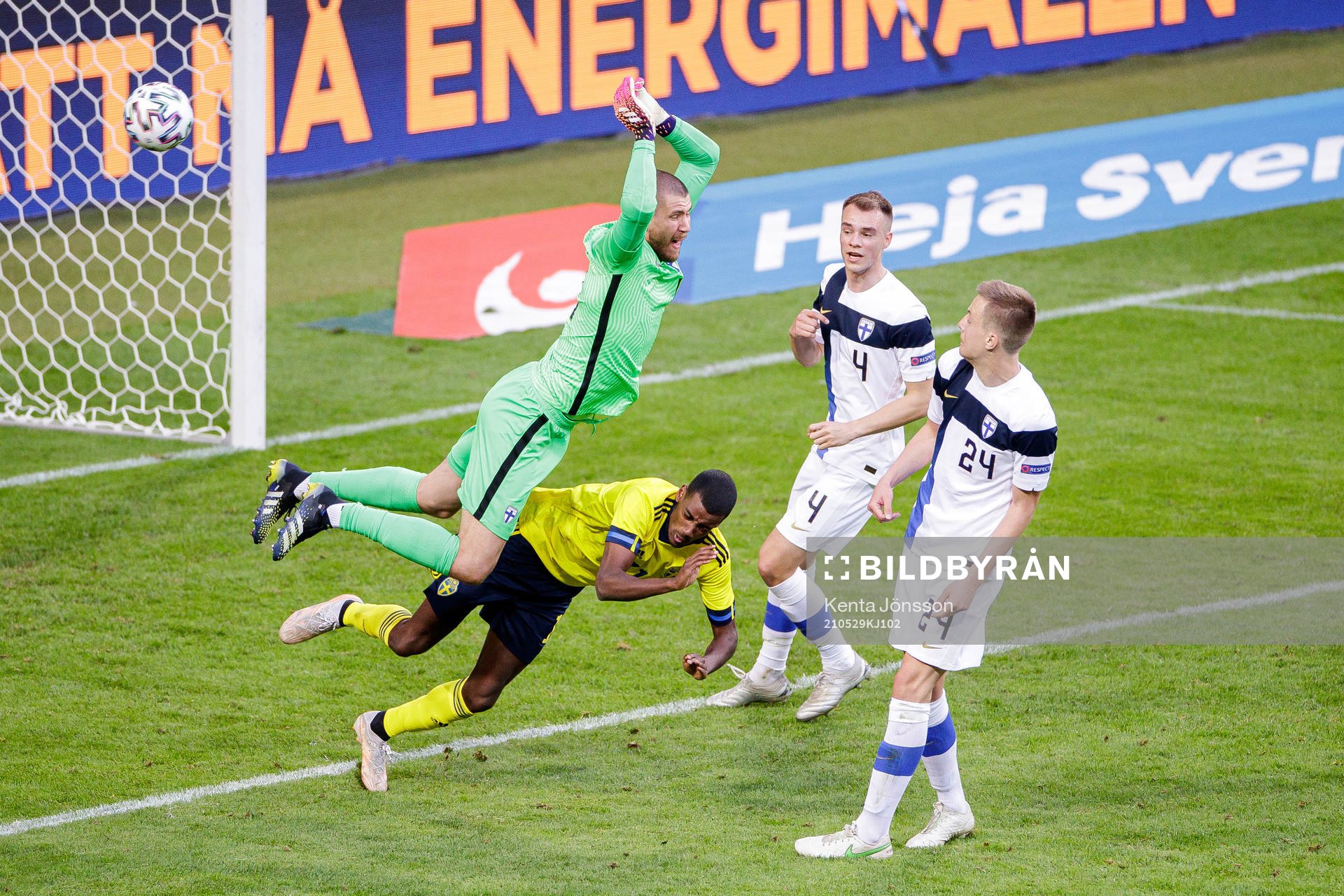Goalkeeper Jesse Joronen of Finland and Alexander Isak of