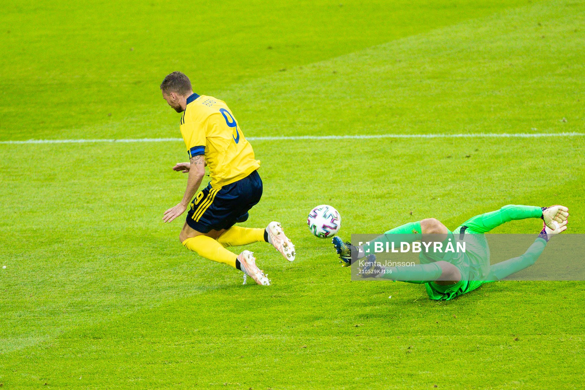 Marcus Berg of Sweden and goalkeeper Jesse Joronen of