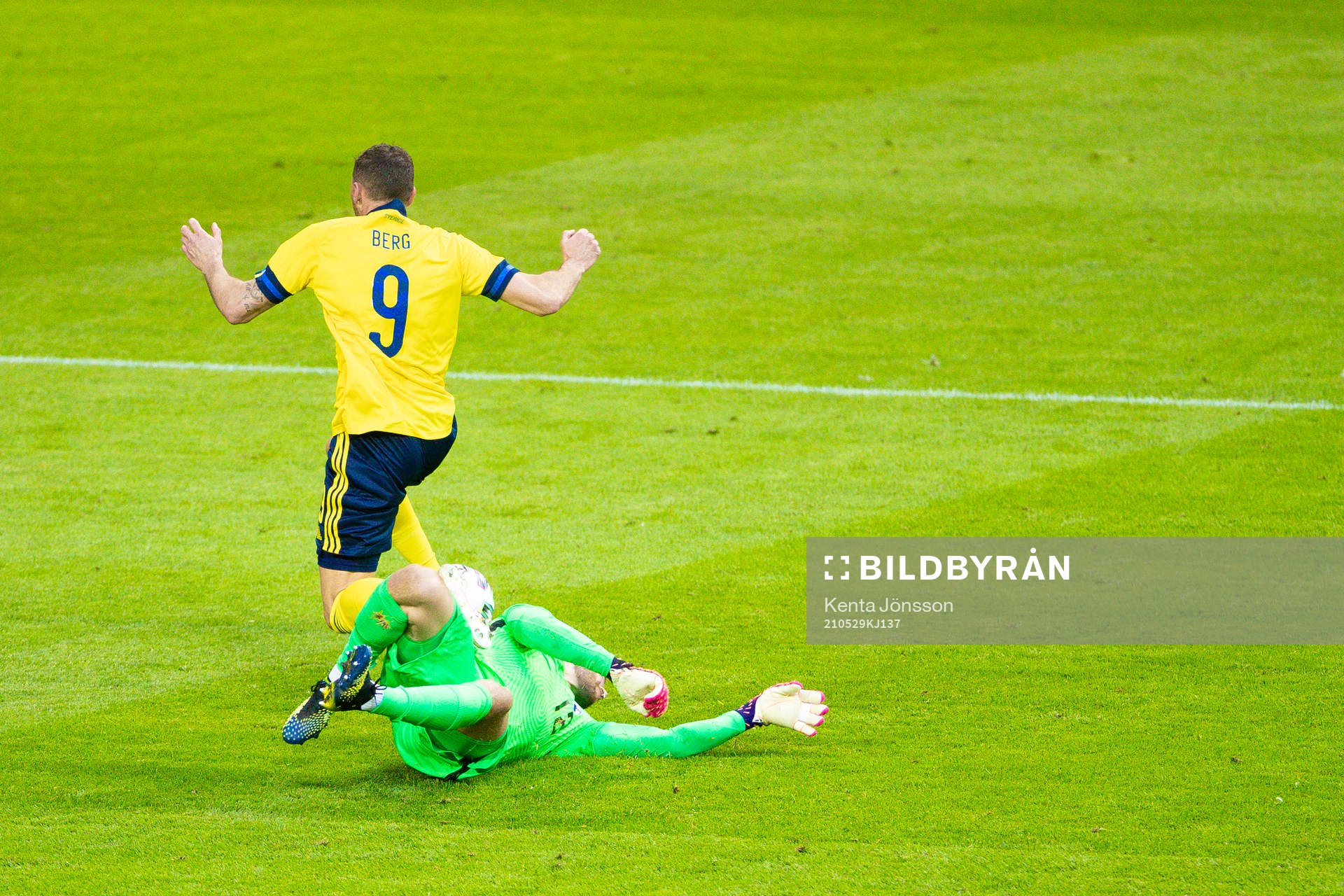 Marcus Berg of Sweden and goalkeeper Jesse Joronen of