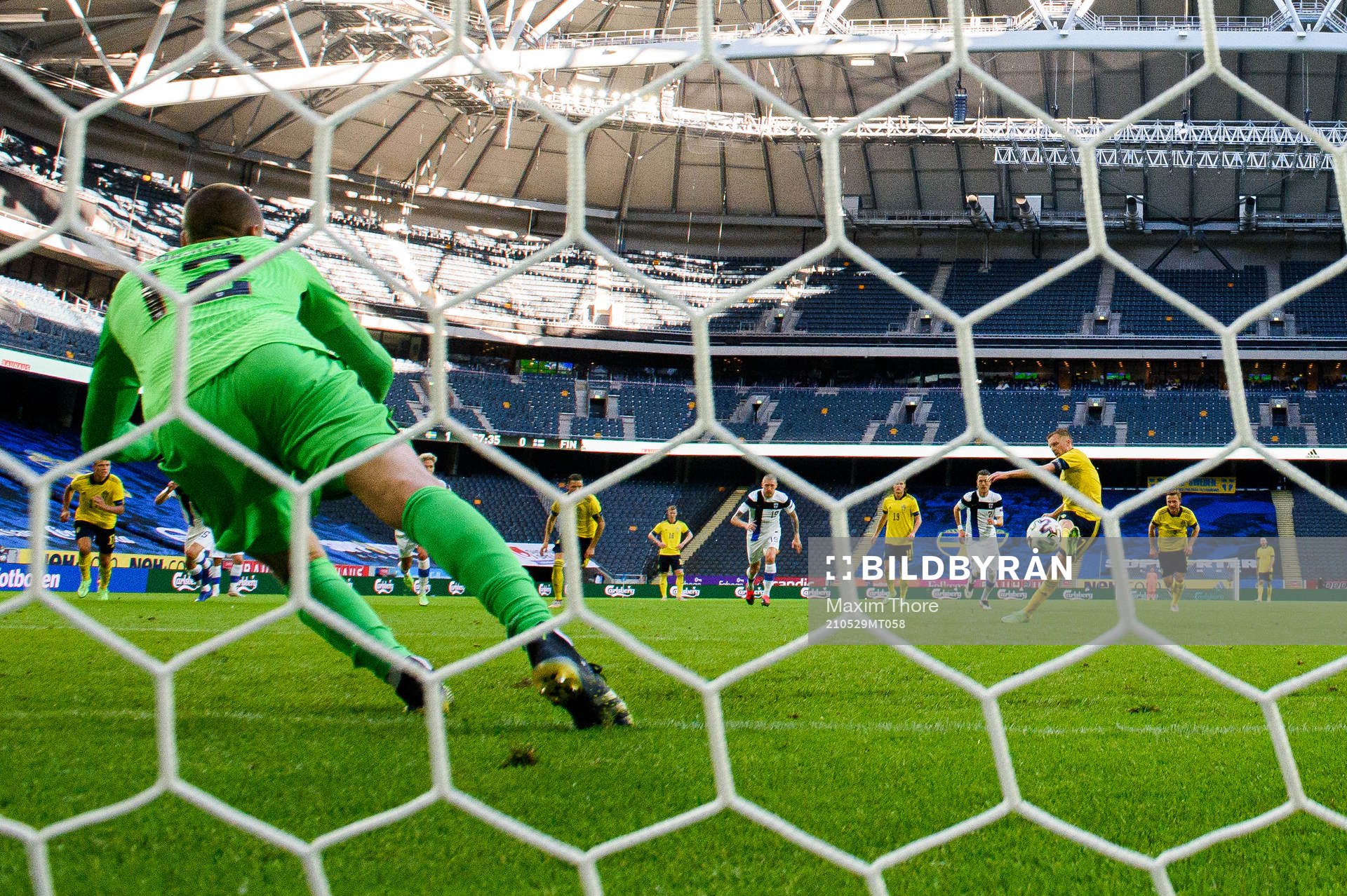 Sebastian Larsson of Sweden scores the 2-0 goal behind