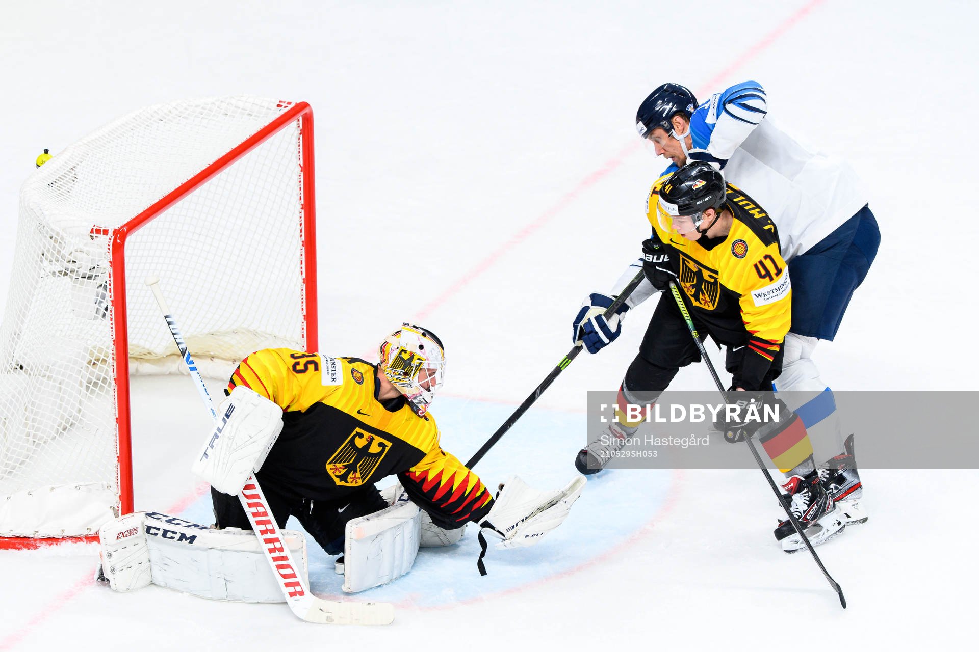 Marko Anttila of Finland against goalkeeper Mathias