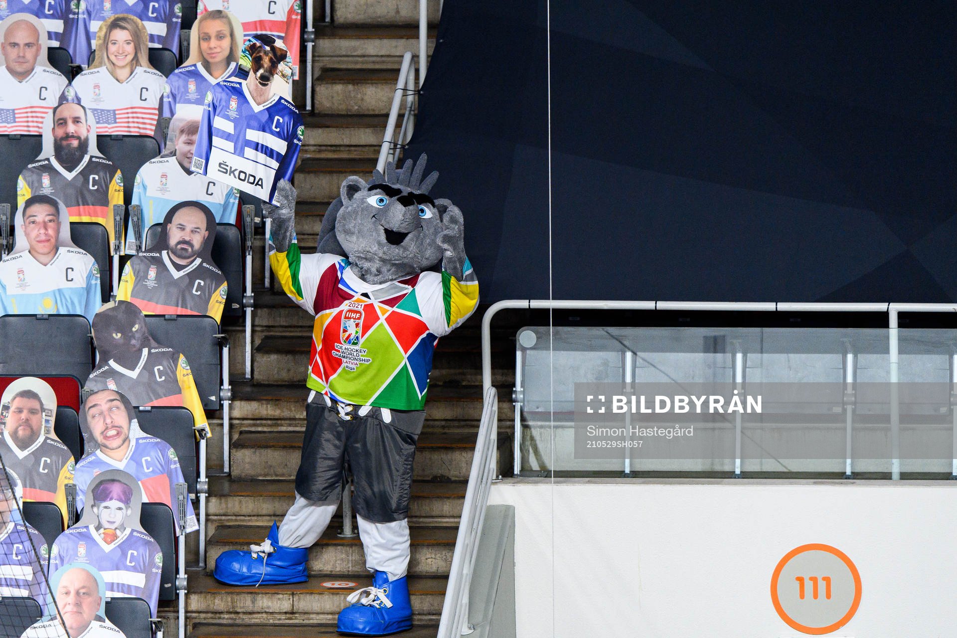 The mascot with a Cut-out photograph of a fan