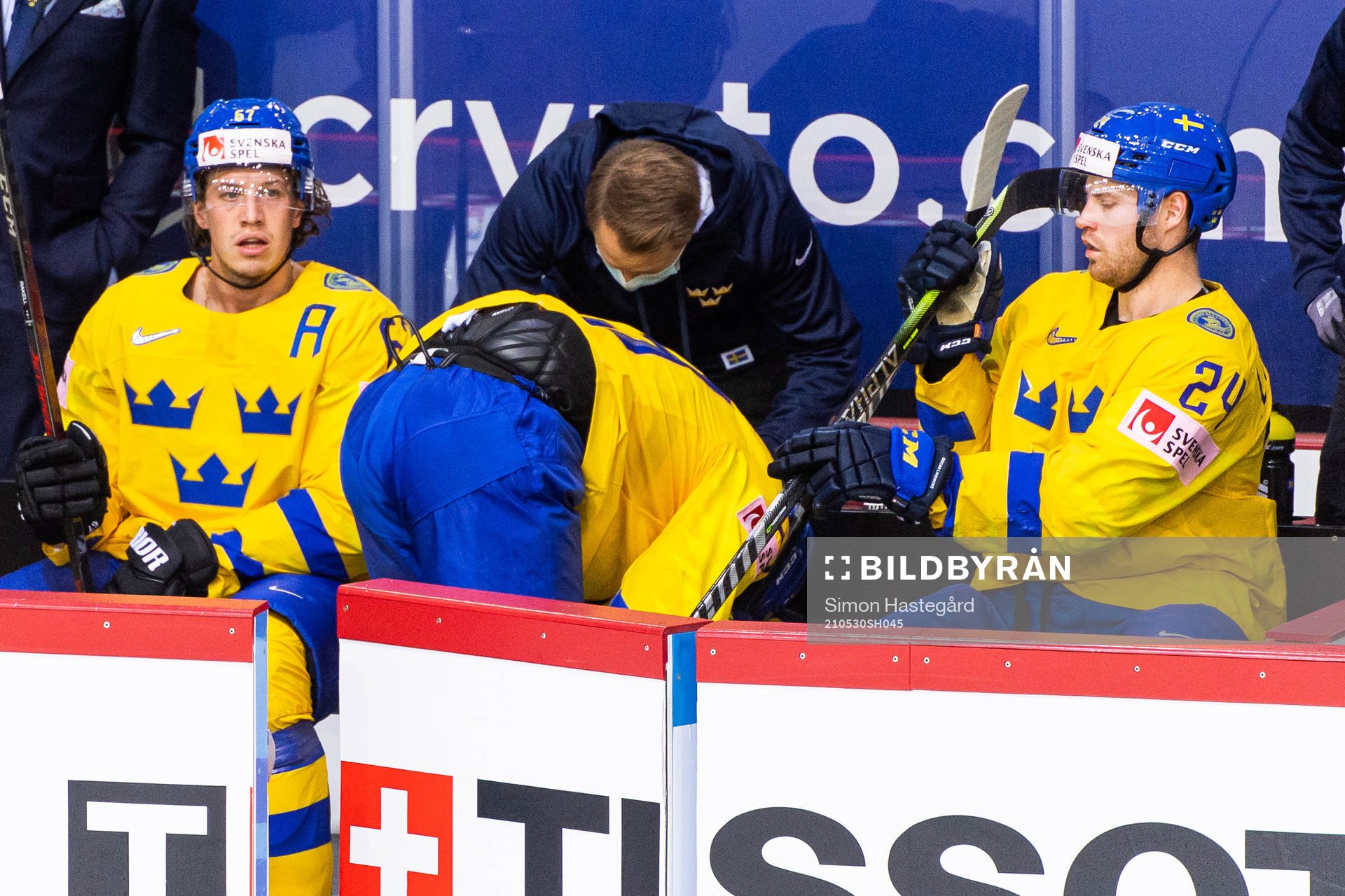 Mario Kempe of Sweden in pain as he leaves the ice