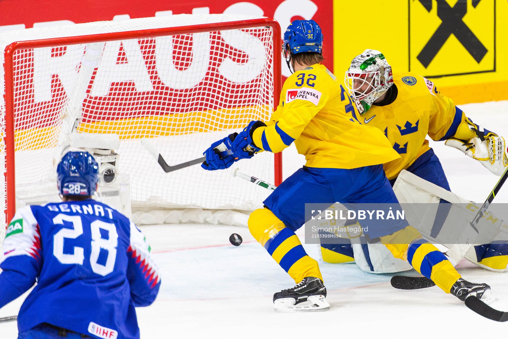Magnus Nygren and goalkeeper Adam Reideborn of Sweden see