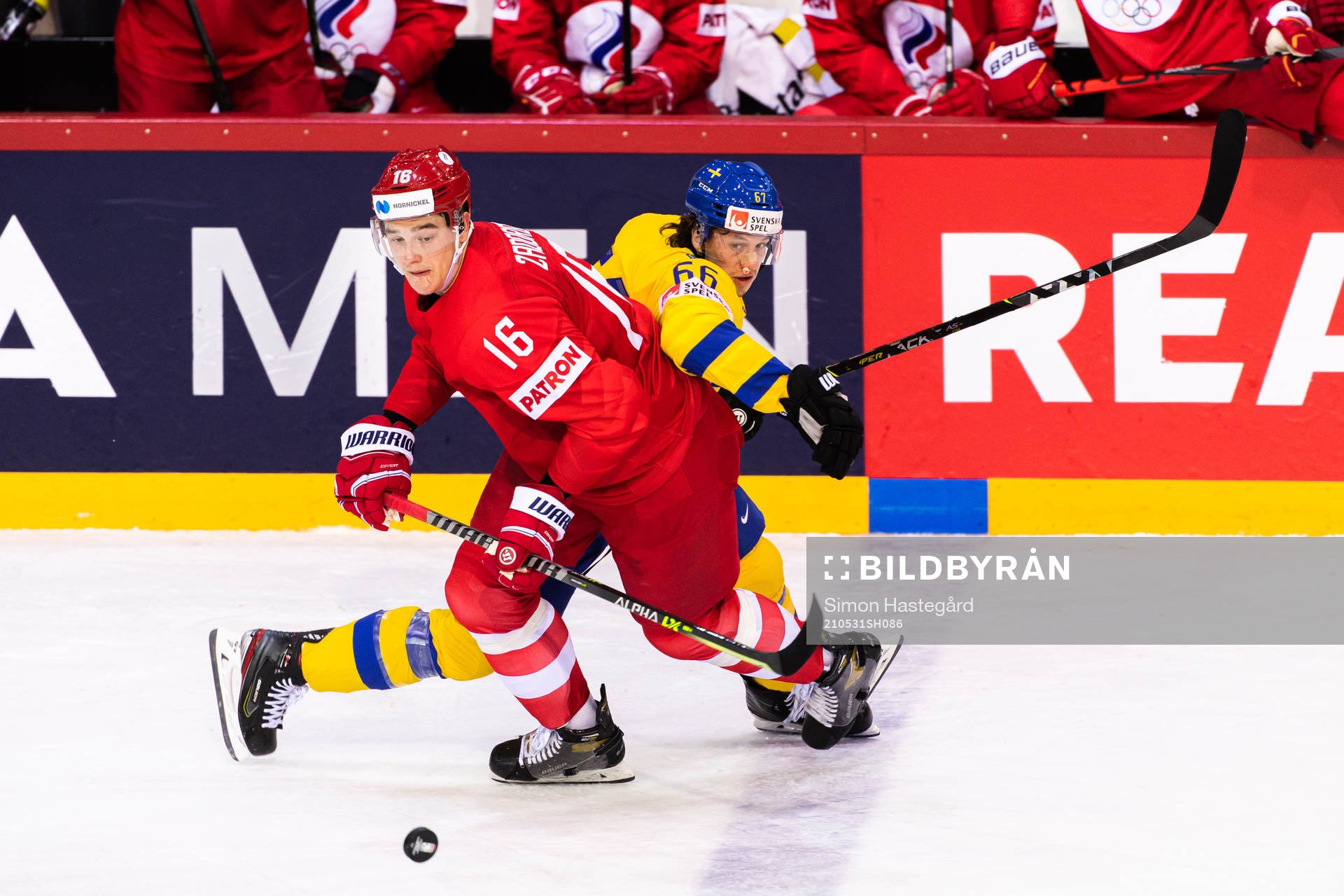 Nikita Zadorov of Russia and Rickard Rakell of Sweden