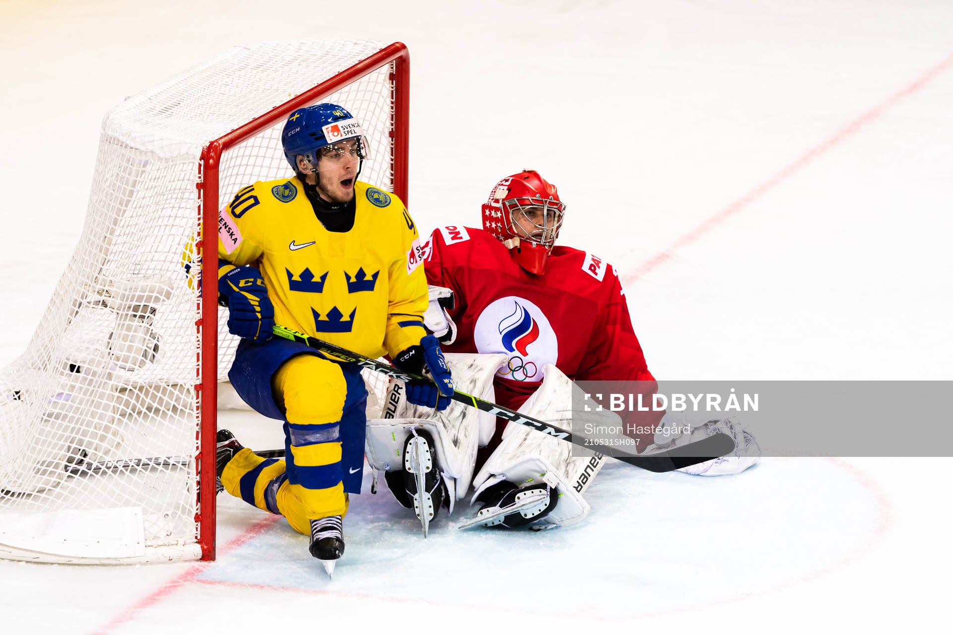 Andreas Wingerli of Sweden and goalkeeper Alexander Samonov