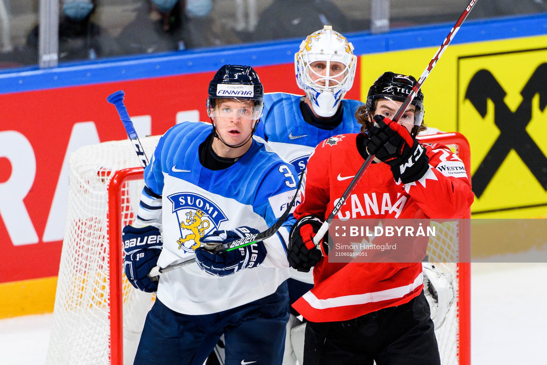Olli Maatta and goalkeeper Jussi Olkinuora of Finland