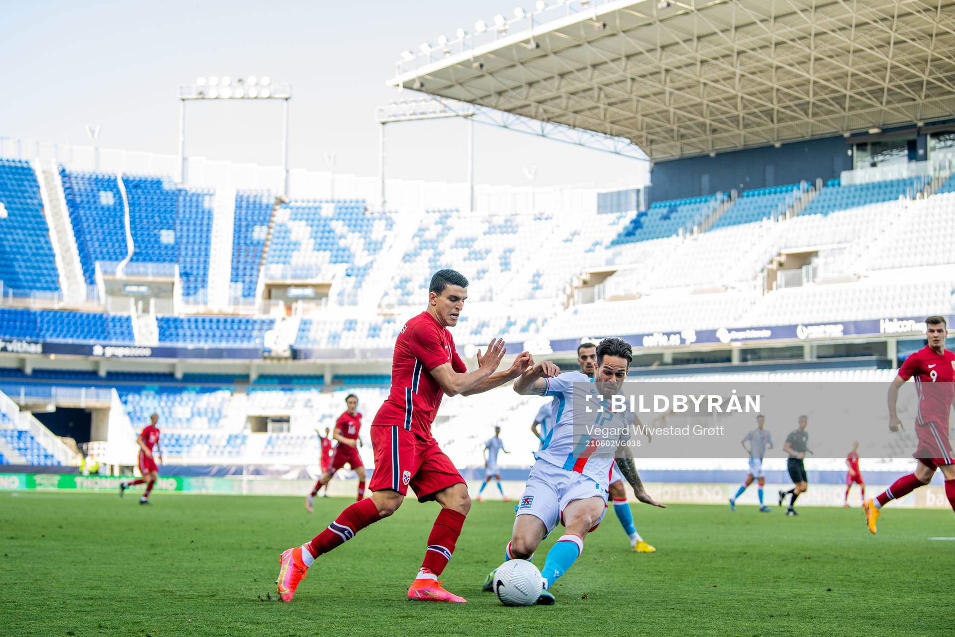 Mohamed Elyounoussi of Norway and Michael Pinto of