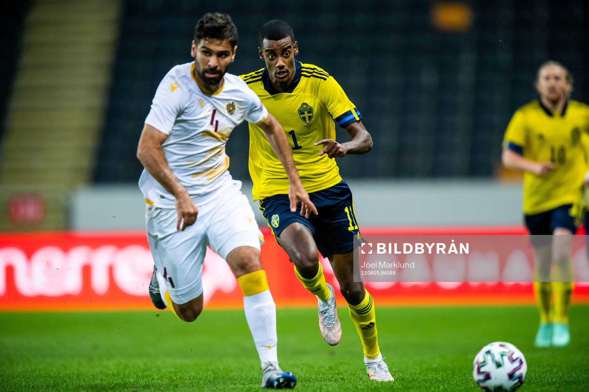 Taron Voskanyan of Armenia and Alexander Isak of Sweden during the international friendly football match between Sweden and Armenia on June 5, 2021 in Stockholm.