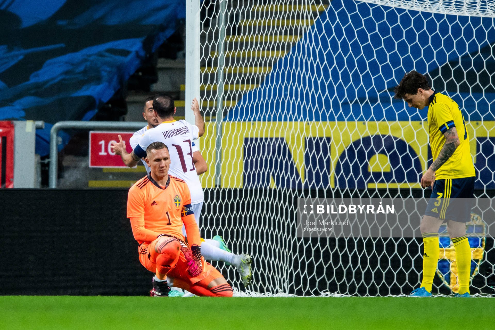 Goalkeeper Robin Olsen of Sweden looks dejected and Vahan