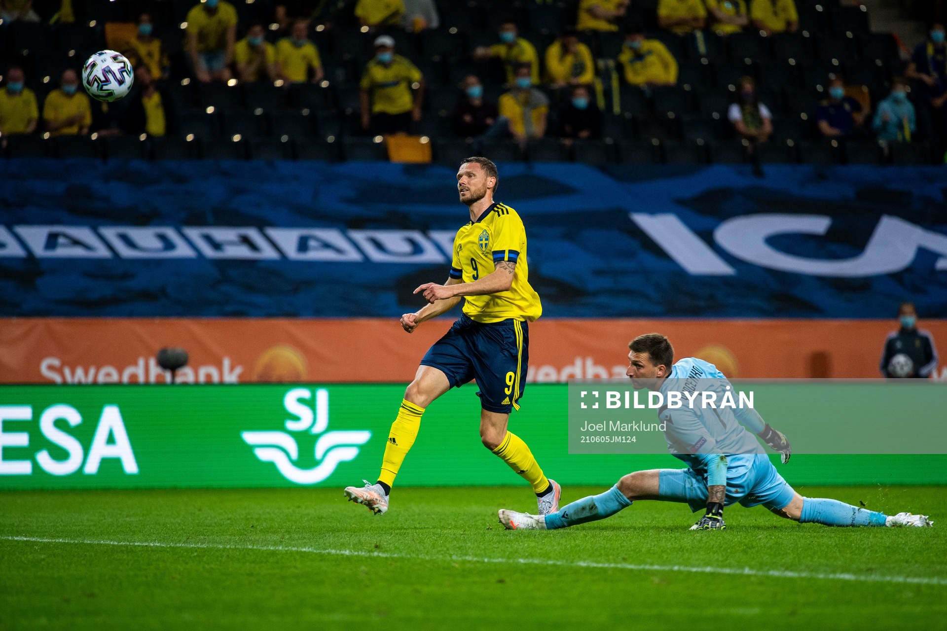 Marcus Berg of Sweden scores 3-1 behind goalkeeper Davit