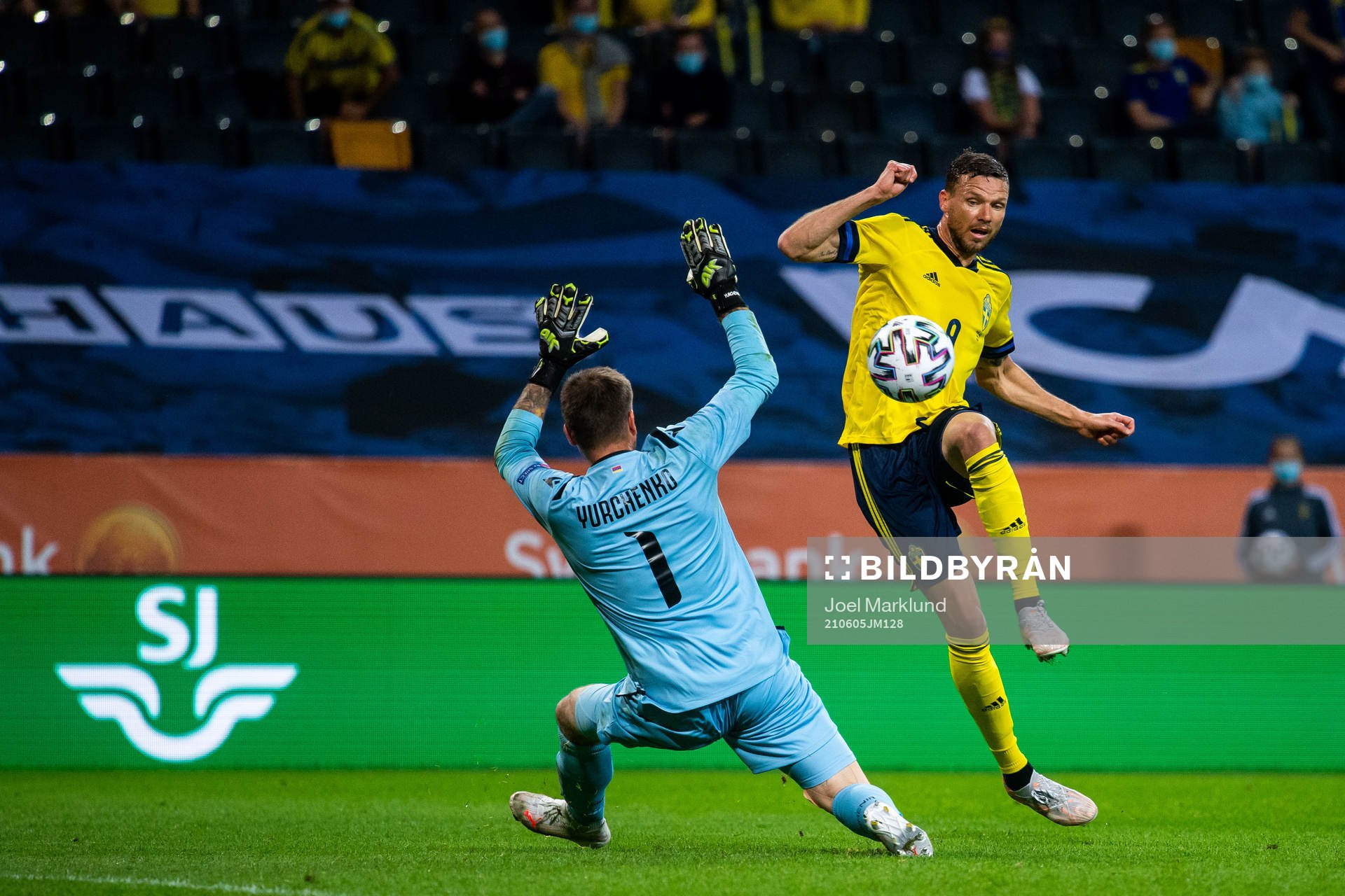 Marcus Berg of Sweden scores 3-1 behind goalkeeper Davit
