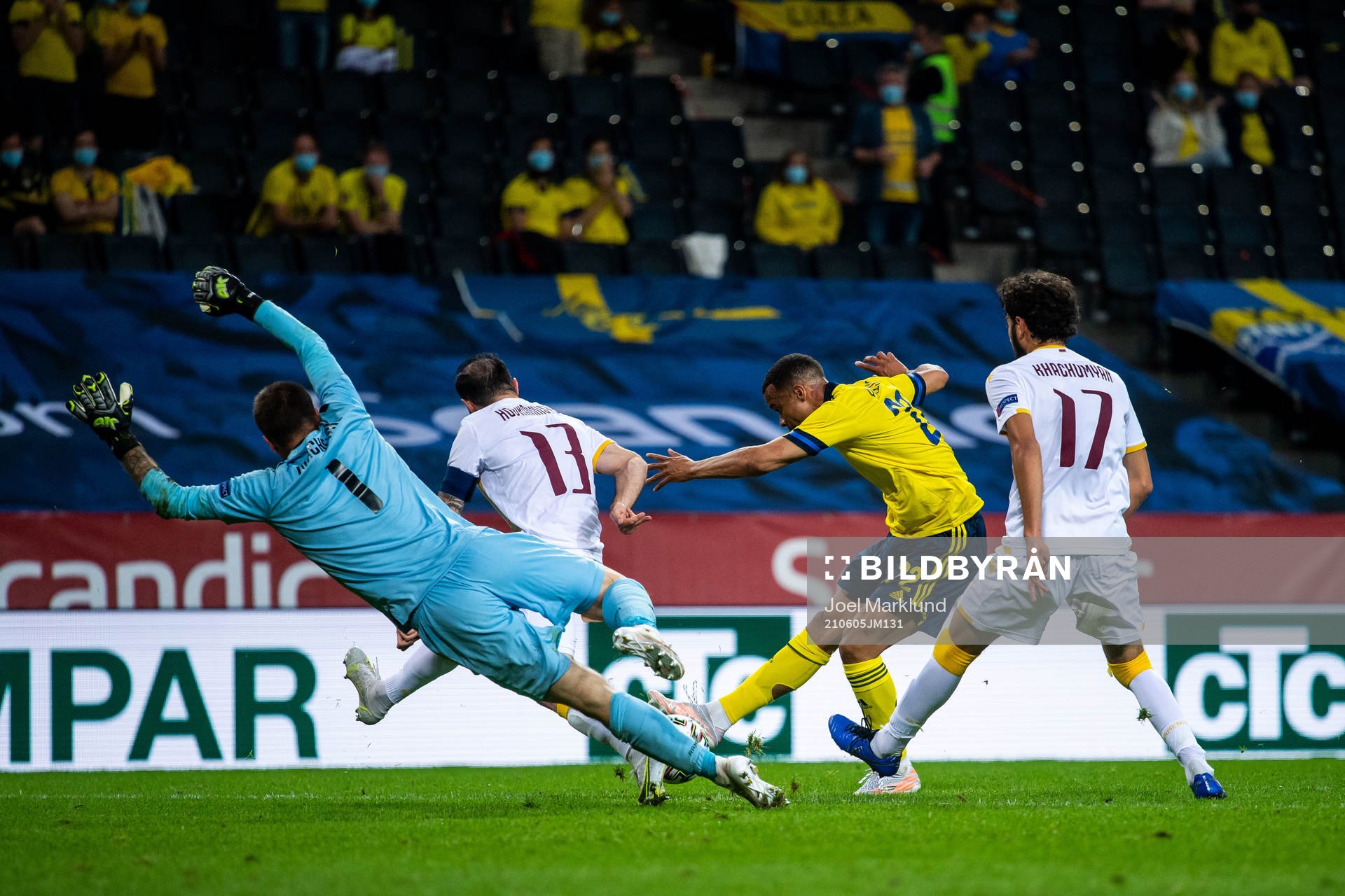 Robin Quaison of Sweden and goalkeeper Davit Yurchenko,
