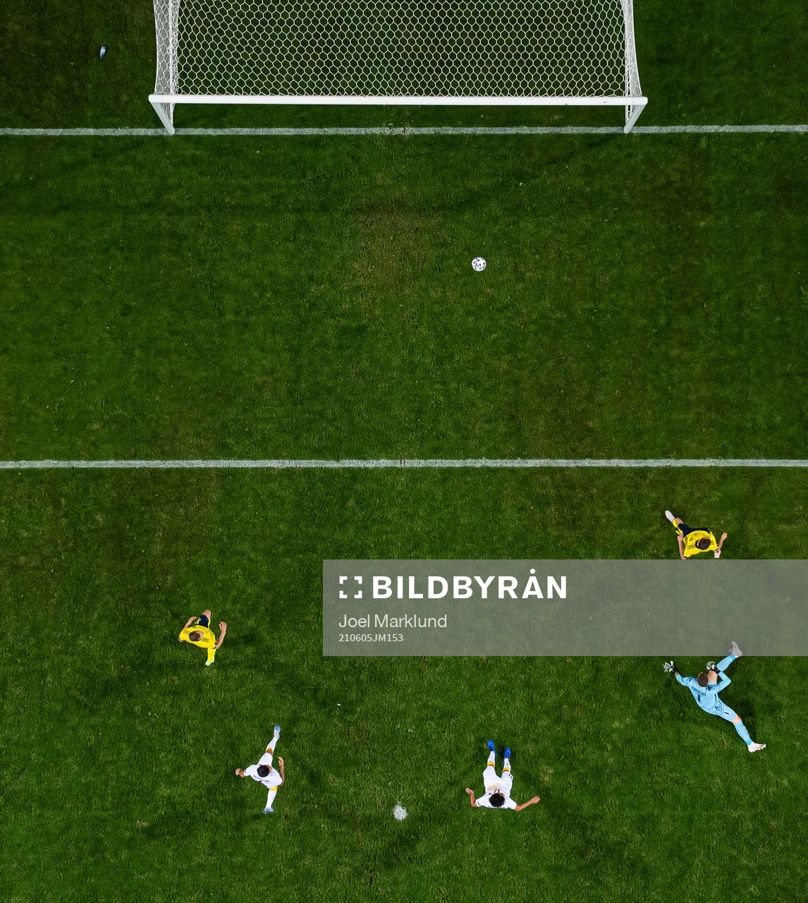 Marcus Berg of Sweden (R) scores 3-1 behind goalkeeper