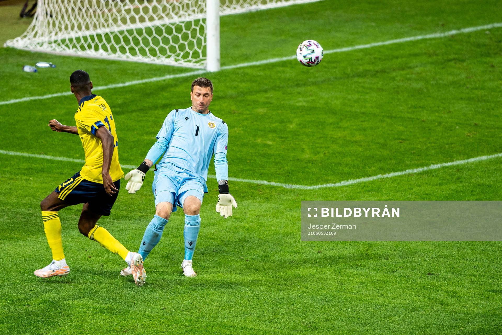 Alexander Isak of Sweden and goalkeeper Davit Yurchenko of