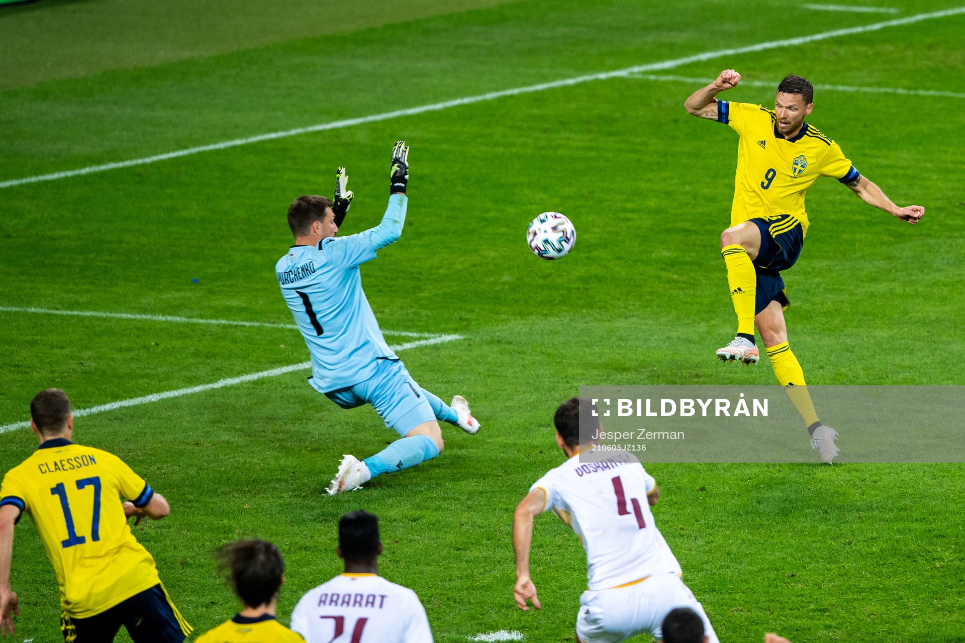 Marcus Berg of Sweden scores 3-1 behind goalkeeper Davit