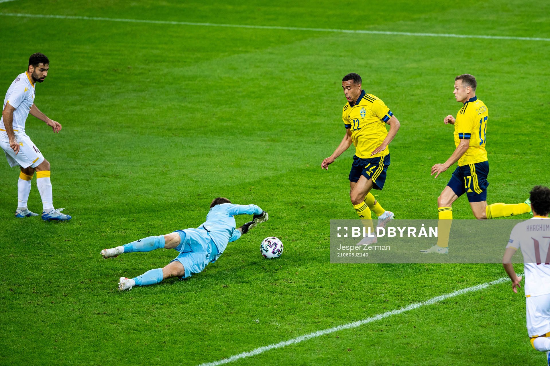 Goalkeeper Davit Yurchenko of Armenia and Robin Quaison and