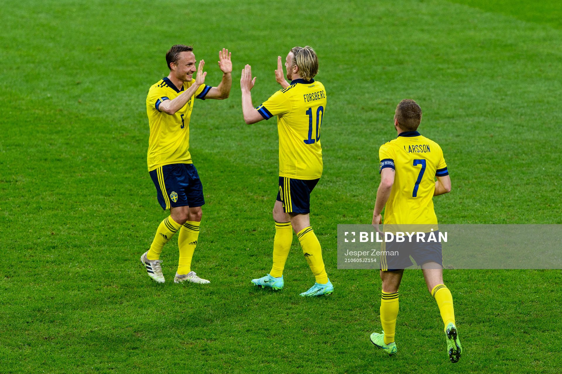 Emil Forsberg (m) celebrate together with Pierre Bengtsson (t.l) and Sebastian Larsson (t.r) after scoring 1-0 during the international friendly football match between Sweden and Armenia on June 5, 2021 in Stockholm.
