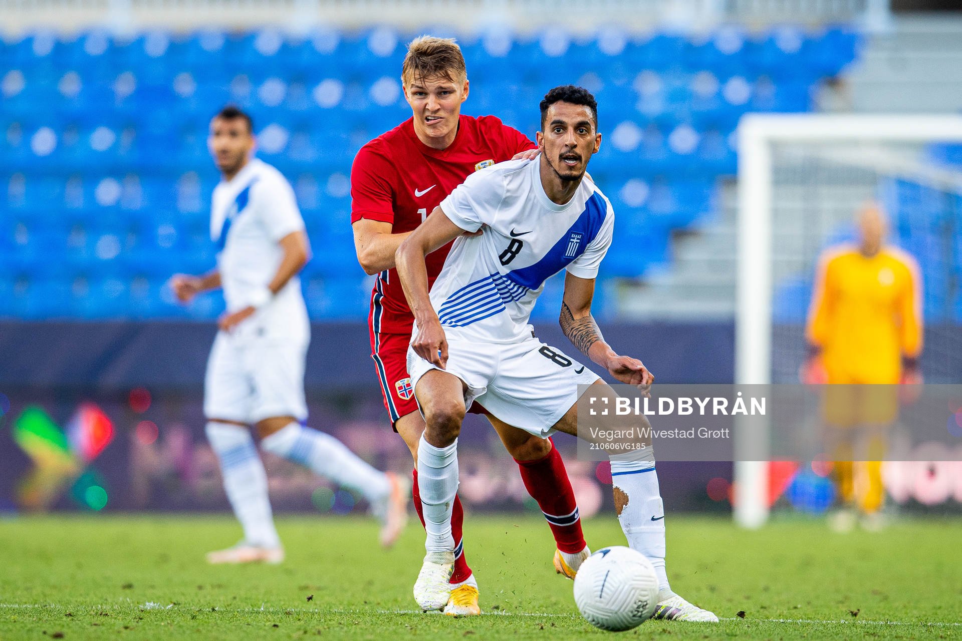 Martin Ødegaard of Norway and Carlos Zeca of Greece